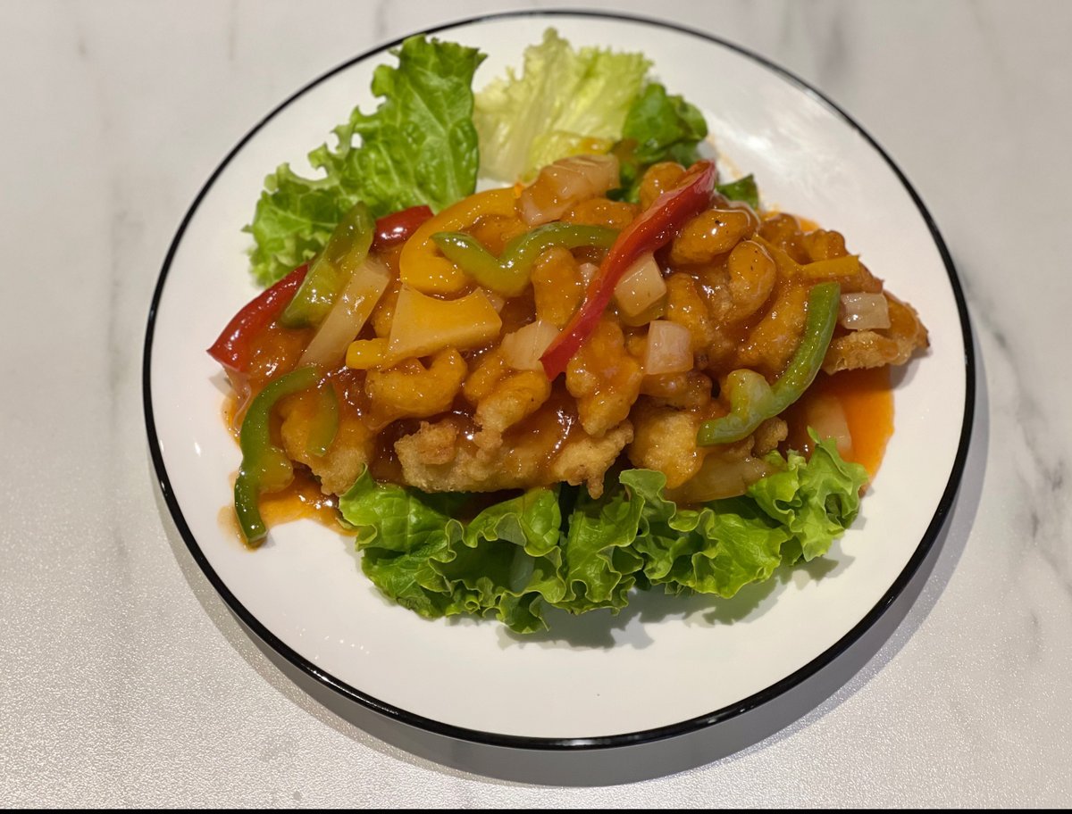 Filete de pescado salteado con salsa agridulce